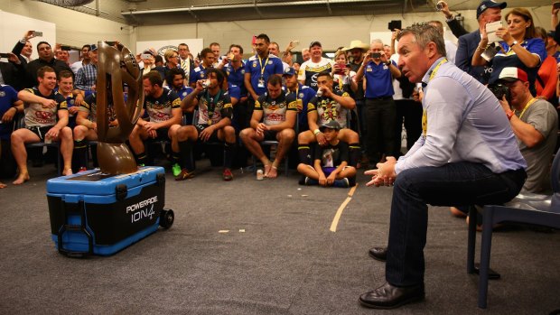 Job done: Cowboys coach Paul Green talks to his players after the grand final.