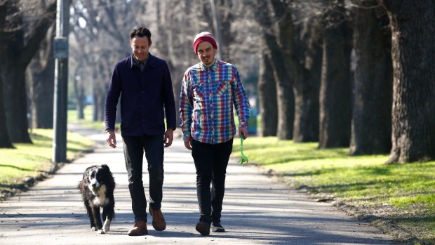 Jason Maling with his dog Fergus and Malcolm Whittaker, in Edinburgh Gardens in Fitzroy North.