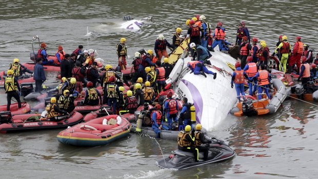 Rescuers carrying out rescue operations from the wreckage of the TransAsia ATR plane back in February.