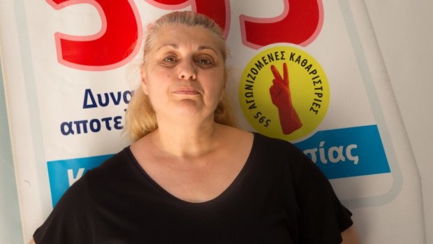 Despina Kostopoulou, cleaning lady, is back at work, paying more tax (in euros) on less pay.