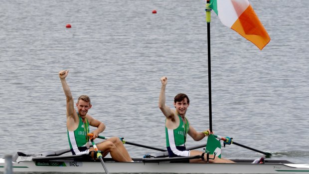 Gary and Paul O'Donovan, of Ireland, celebrate their silver in the men's rowing lightweight double sculls.
