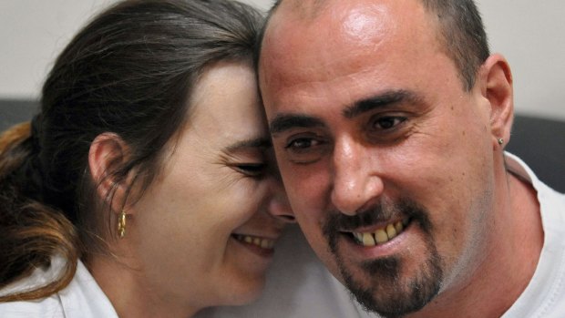 In this March 25, 2008 Serge Atlaoui (right), Frenchman on death row, is seen with wife Sabine Atlaoui (left) during a visit at Nusakambangan prison island. 