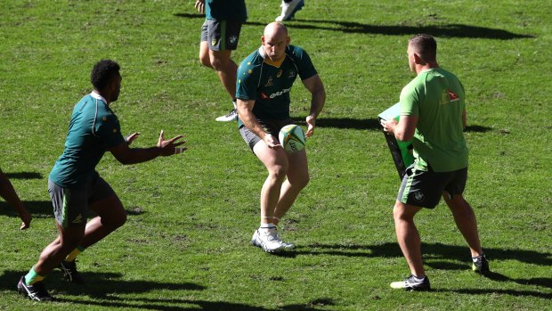 Captain's run: Stephen Moore offloads at training.