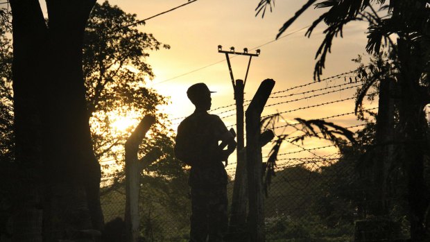 A border patrol guard at a police post in Kyee Kan Pyin, Buthidaung, in the Rakhine state of Myanmar.