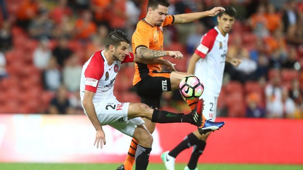 Commanding performance: Terry Antonis and Jamie Maclaren compete for the ball.
