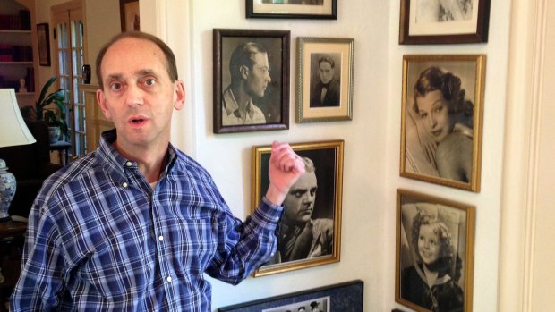 Died at home ... Missouri Auditor Tom Schweich shows off some of the movie-star photos in his collection of autographed memorabilia from the golden age of Hollywood during at his home in Clayton, Missouri. 