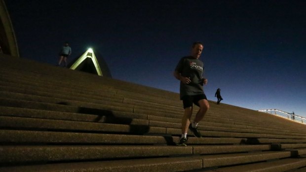 Opposition Leader Bill Shorten runs down the stairs of the Sydney Opera House on Saturday morning.