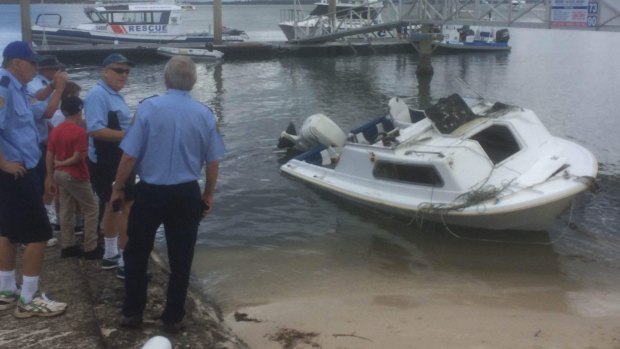 Two men and a boy were rescued after their boat capsized near Bribie Island.