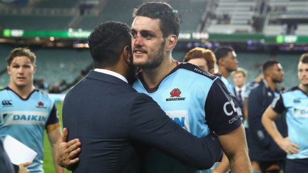 Home farewell: Injured Waratahs star Kurtley Beale and Dave Dennis embrace following the final home game of the year last weekend.