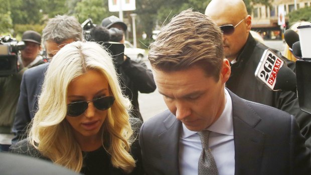 Oliver Curtis and his wife Roxy Jacenko arrive at the NSW Supreme Court on Friday.