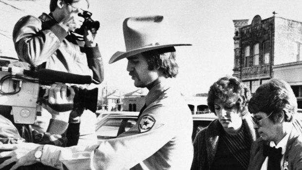 Genene Jones, centre, arrives at court in Georgetown, Texas, where she was sentenced to 99 years in prison, in 1984.