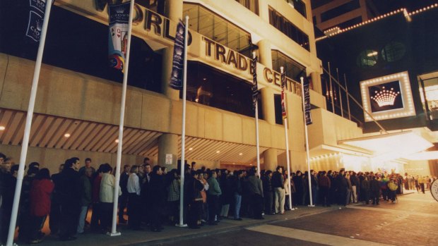 People queue to get into the temporary Crown Casino at the World Trade Centre. 