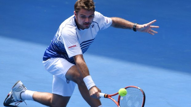 Carefully does it: Stan Wawrinka hits a return to Guillermo Garcia-Lopez of Spain in their fourth-round encounter.