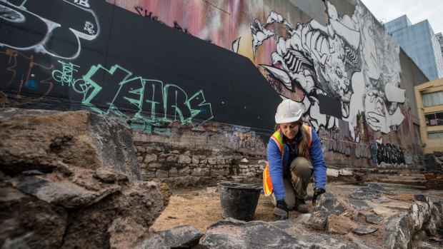 Sarah Myers at work on an archaeological dig at the site of the old Mistletoe Hotel in Melbourne.