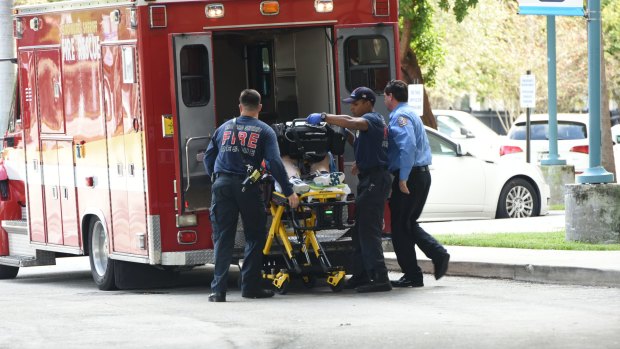 A shooting victim is unloaded from an emergency vehicle and taken into Broward Health Trauma Center in Fort Lauderdale.