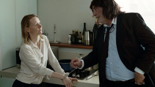 Sandra Huller as Ines (left) and and Peter Simonischek as Winfried have their familial bond tested in <i>Toni Erdmann</i>.