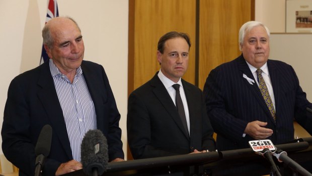 Environment Minister Greg Hunt says the Climate Change Authority, headed by Bernie Fraser (left), "might as well do work" given he has promised not to abolish it under the deal with Clive Palmer (right).
