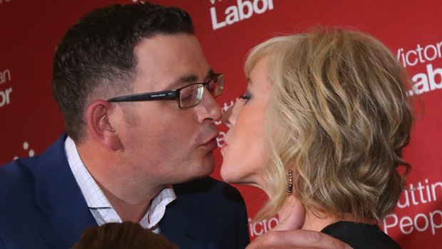 Incoming Victorian Premier Daniel Andrews kisses his ''secret campaign weapon'', wife Cath after his victory speech.