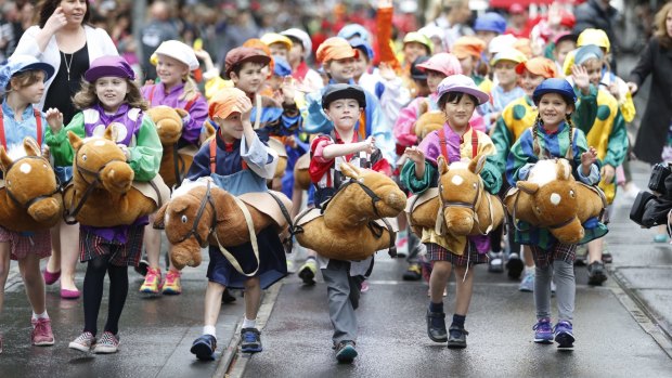 Children take part in the Melbourne Cup parade on Monday.