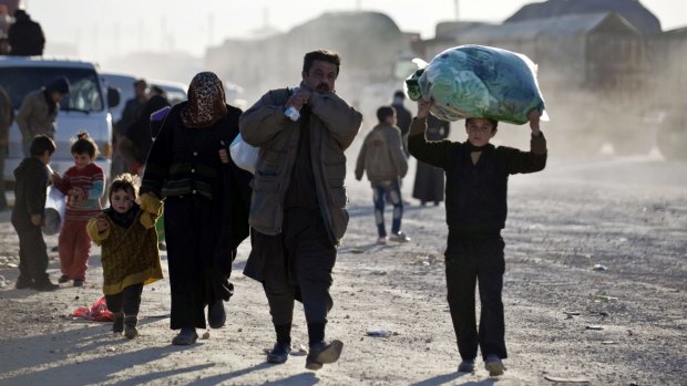 Syrians walk towards the Turkish border in the hope of finding sanctuary.