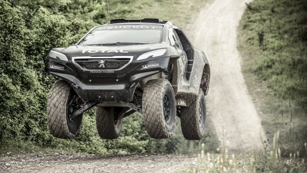 Peugeot returns to the Dakar Rally with a radical two-wheel drive buggy driven by an all-star trio.