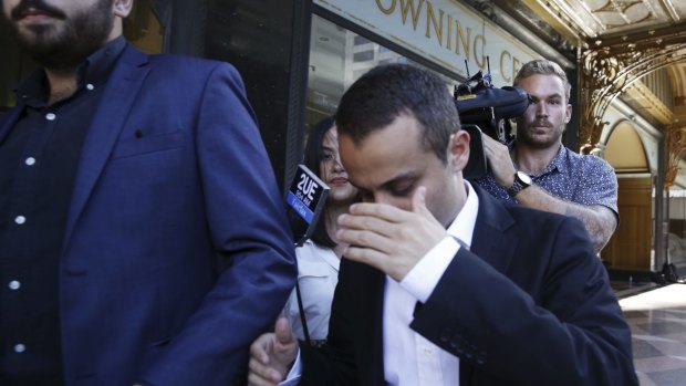 Emotional: Luke Lazarus leaves Sydney's Downing Centre Court.
