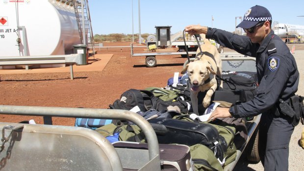 Police searching for drugs at Fortescue Metals Group's Christmas Creek mine site in the Pilbara.