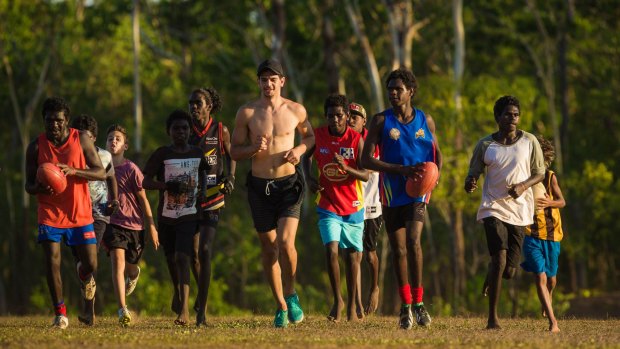 At home: Jake Long (centre) surrounded by youngsters at Pickataramoor on Melville Island.