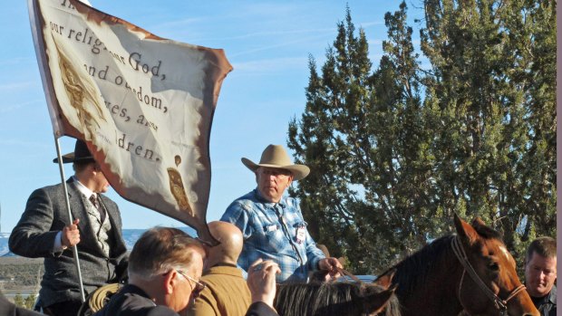 Cliven Bundy, on horseback at centre, joins the funeral procession for Arizona rancher Robert "LaVoy" Finicum in Kanab, Utah, last week.