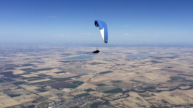 Kari Roberson gliding over  Rochester, Victoria, with Greens Lake and Lake Cooper in the background.