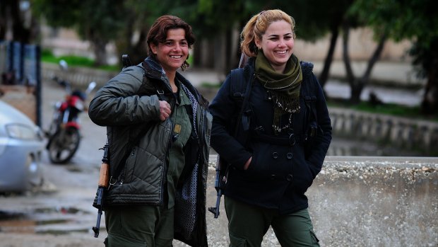 Young women guard the Asayish (Kurdish intelligence agency) headquarters in Tel Tamer, where Islamic State militants had earlier attacked a string of Assyrian villages along the Khabur River, kidnapping at least 220.  