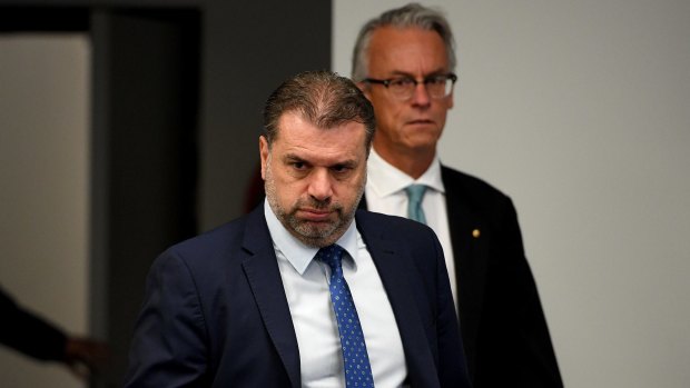 Ange Postecoglou and David Gallop arrive at the press conference on Wednesday.