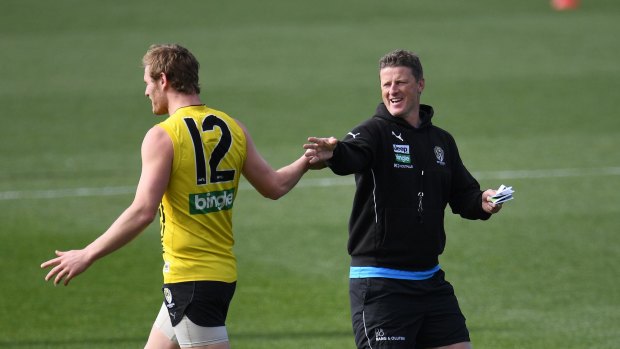 David Astbury shares a moment with coach Damien Hardwick at training on Tuesday.