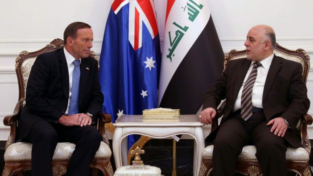 Tony Abbott and  Iraqi Prime Minister Haider al-Abadi speaking on Sunday. 