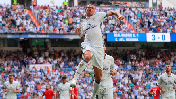 Too easy: Pepe celebrates scoring Real Madrid's fourth goal against Osasuna.