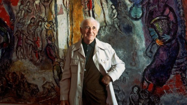 Artist Marc Chagall, photographed in France in 1977, in front of a work inspired by the Bible.