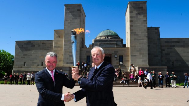 Dr Brendan Nelson Director of the Australian War Memorial and Alan Ferguson Chairman of Camp Gallipoli holding the RSL Anzac Flame.