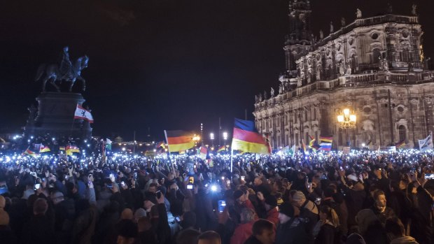 Mass protest: Thousands of activists gather  in the east German city of Dresden on December 22 for a rally of "Patriotic Europeans against the Islamisation of the West".