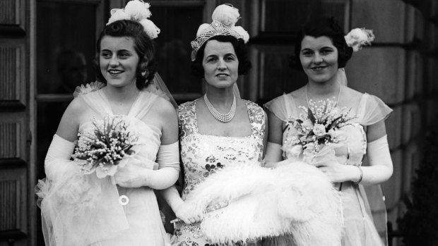 Mrs Rose Kennedy, wife of Joseph Kennedy, American ambassador to Britain, with her daughters Kathleen (left) and Rosemary, leaving their London house to be presented at court. 