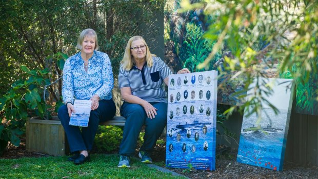 Author Dr Kathryn Spurling, who wrote Mystery of AE1, Australia's lost submarine and crew, and artist Margaret Hadfield with her painting Known Unto God AE1. The pair are quietly commemorating the submarine's discovery.