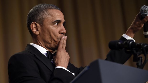 "Obama out": The US President drops the mic to conclude his speech at the annual White House Correspondents' Association dinner in Washington on Saturday.