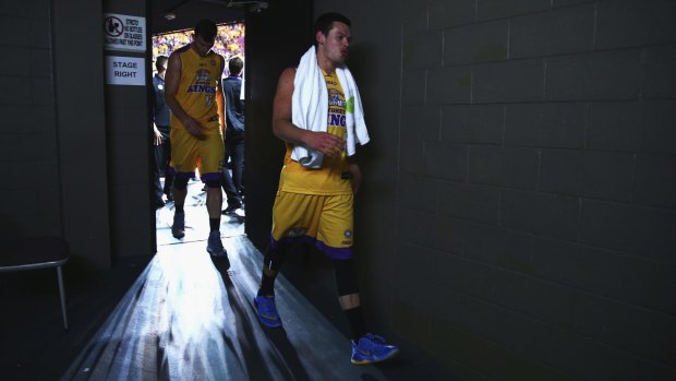 Out of the spotlight: Jason Cadee walks from the court after the win over the Taipans.