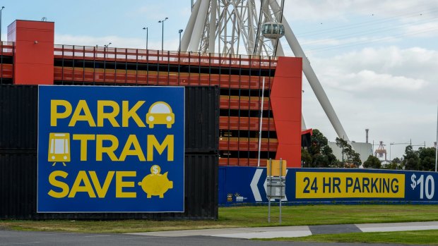 Signs advertising the Harbour Town Docklands carparks which encourage people to park and catch the free tram. Photo by Penny Stephens. The Age. 11TH MAY 2015