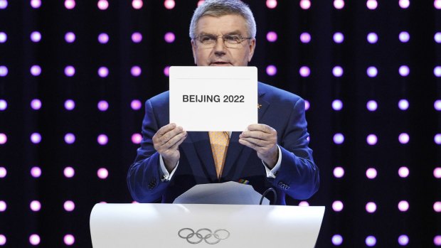 And the winner is ... President of the International Olympic Committee Thomas Bach opens the envelope in Kuala Lumpur.