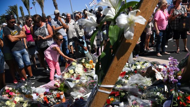 Mourners at the scene of French terror attacks in Nice.