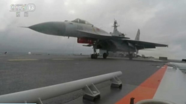 CCTV via AP Video, a J-15 fighter jet takes off from the flight deck of the aircraft carrier Liaoning during a drill in the South China Sea. 