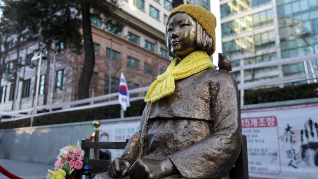A statue of a girl symbolising the issue of "comfort women" in front of the Japanese Embassy on in Seoul, South Korea. 