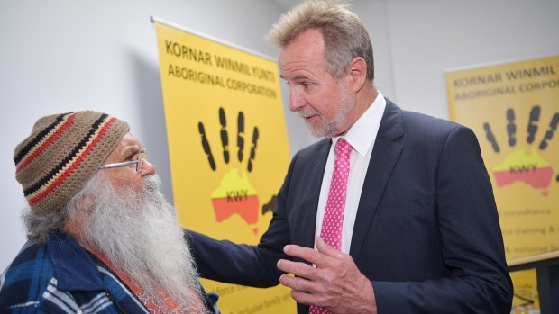 Federal Minister for Indigenous Affairs, Nigel Scullion, speaks to Local Elder Uncle Moogi at the Kornar Winmil Yunti Aboriginal Corporation in Adelaide.