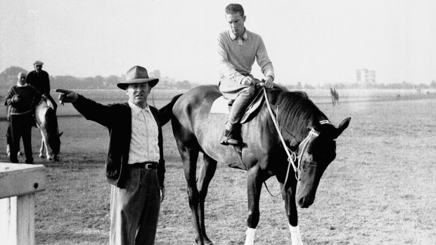 Controversial performance: The 1960 Melbourne Cup runner Tulloch with trainer Tommy Smith.