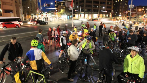 Cyclists protesting the state government's plans to rip up a cycleway on College Street.